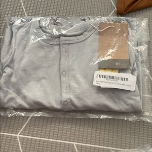 Kyte baby snap foootie in storm 1 new and one lightly used 12-18